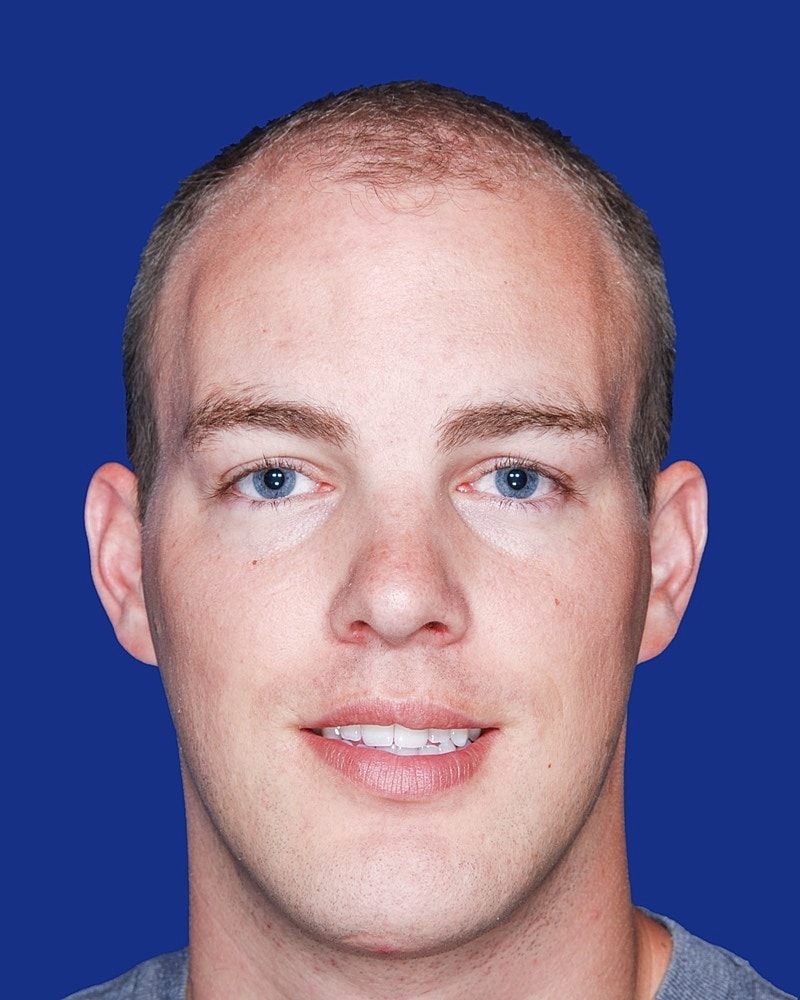 Portrait of a man with short hair.