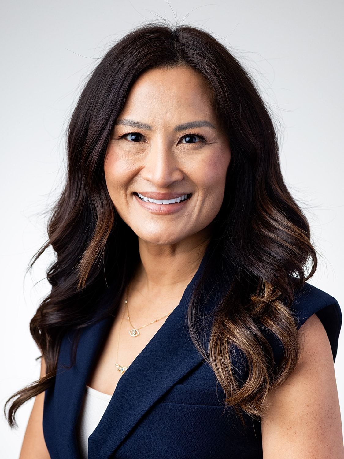 Professional headshot of a smiling woman.