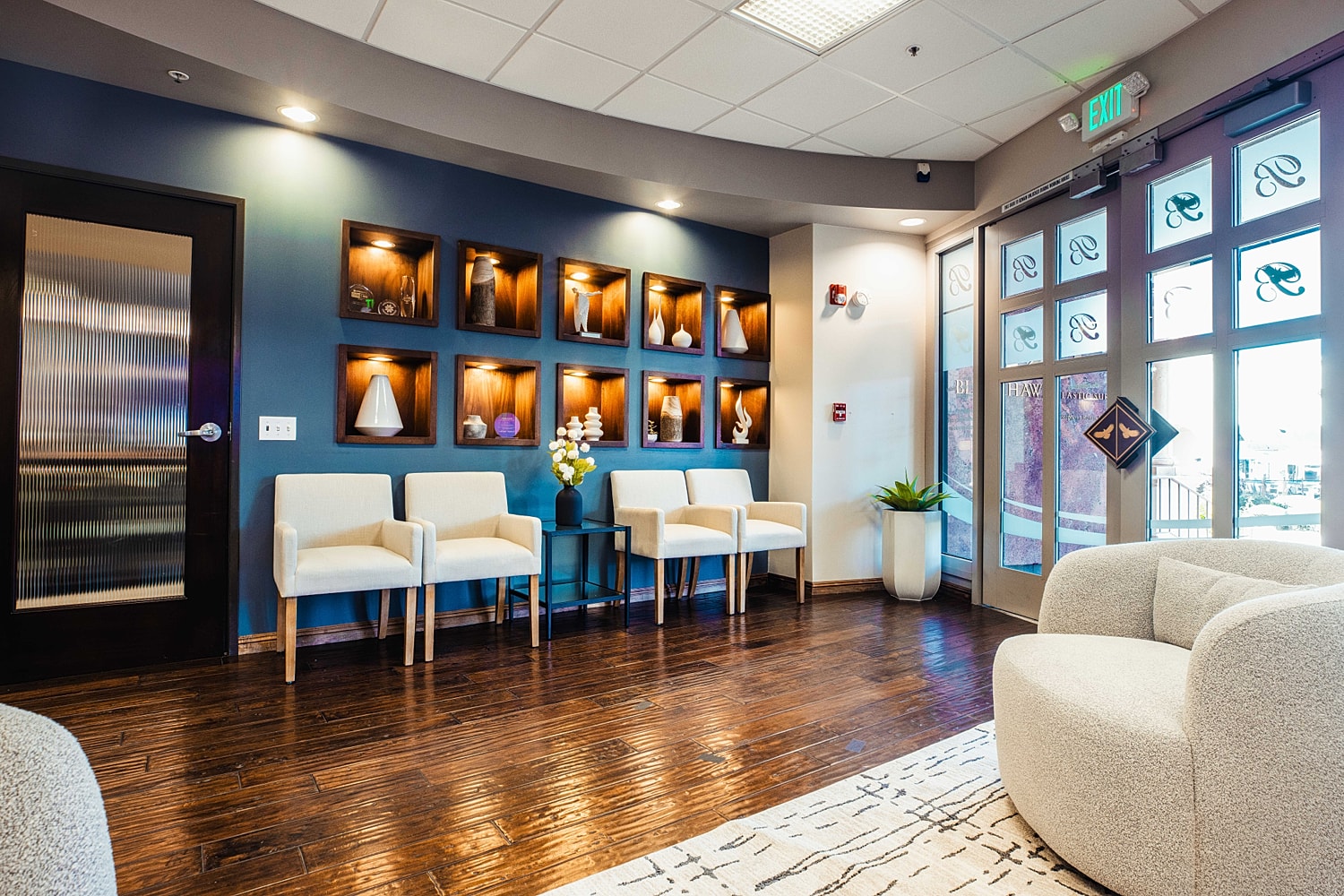 Modern waiting area with stylish decor and seating.