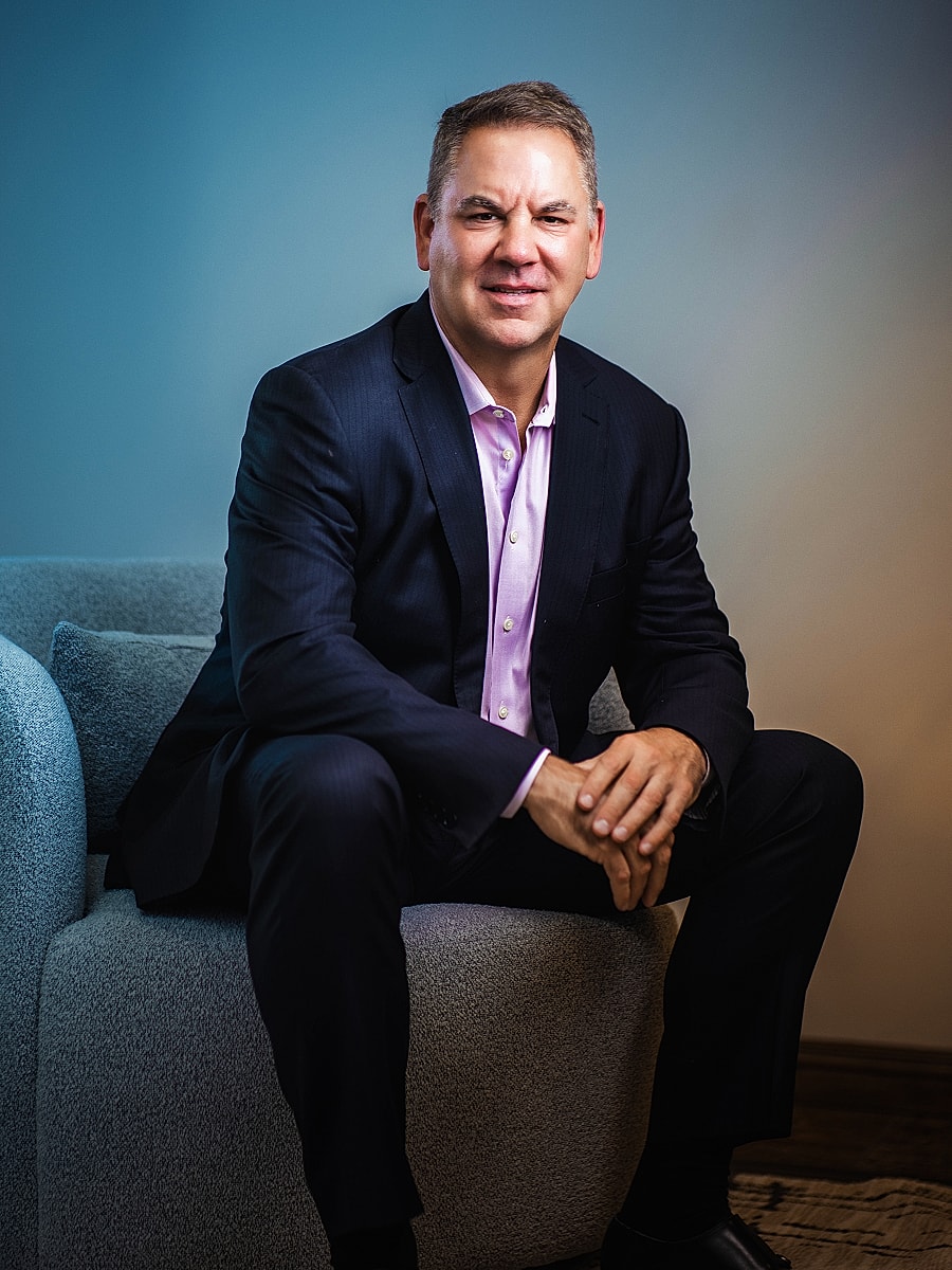 Professional man sitting on a modern couch.
