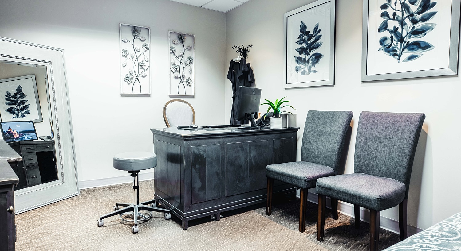 Modern office space with plants and artwork.
