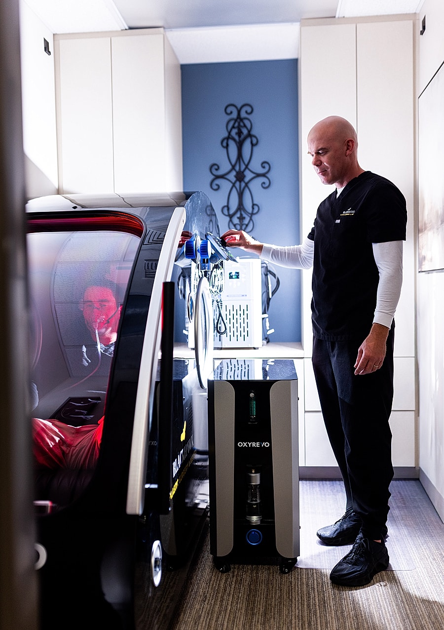 Medical professional using hyperbaric oxygen therapy equipment