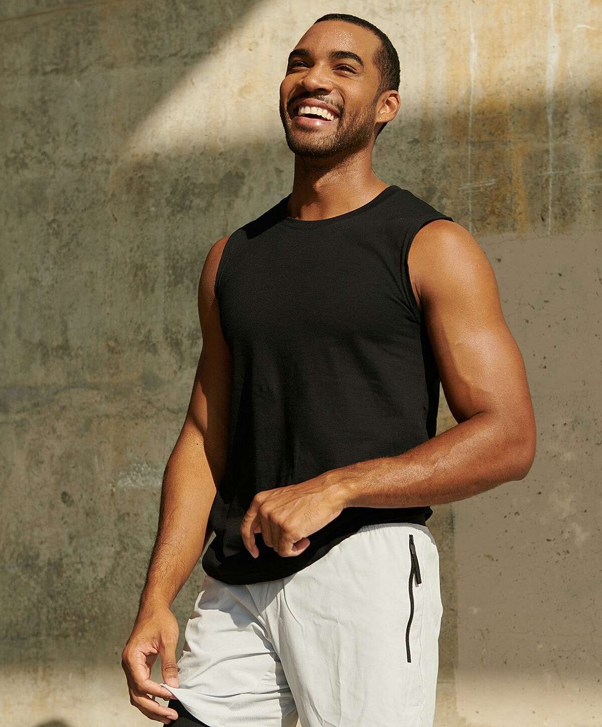 Smiling man in casual athletic attire outdoors