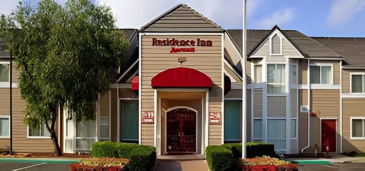 Residence Inn building exterior with welcoming entrance.