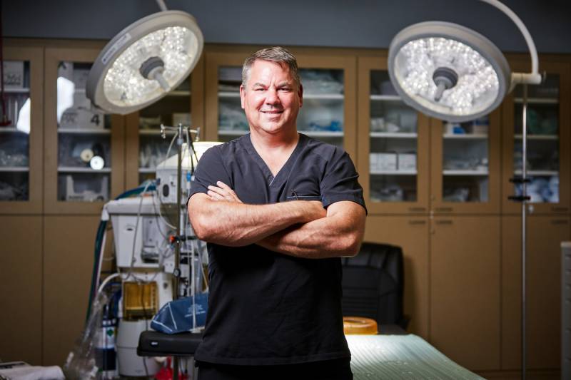 Dr. Stephen Ronan in surgical suite with AviClear laser equipment