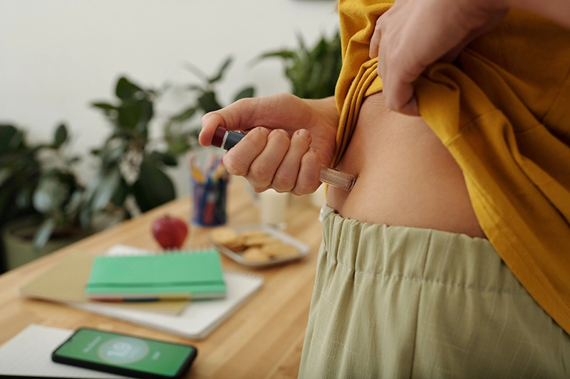 Person Injecting Themselves with a GLP-1 Pen