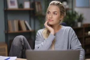 a woman considers breast reduction surgery cost